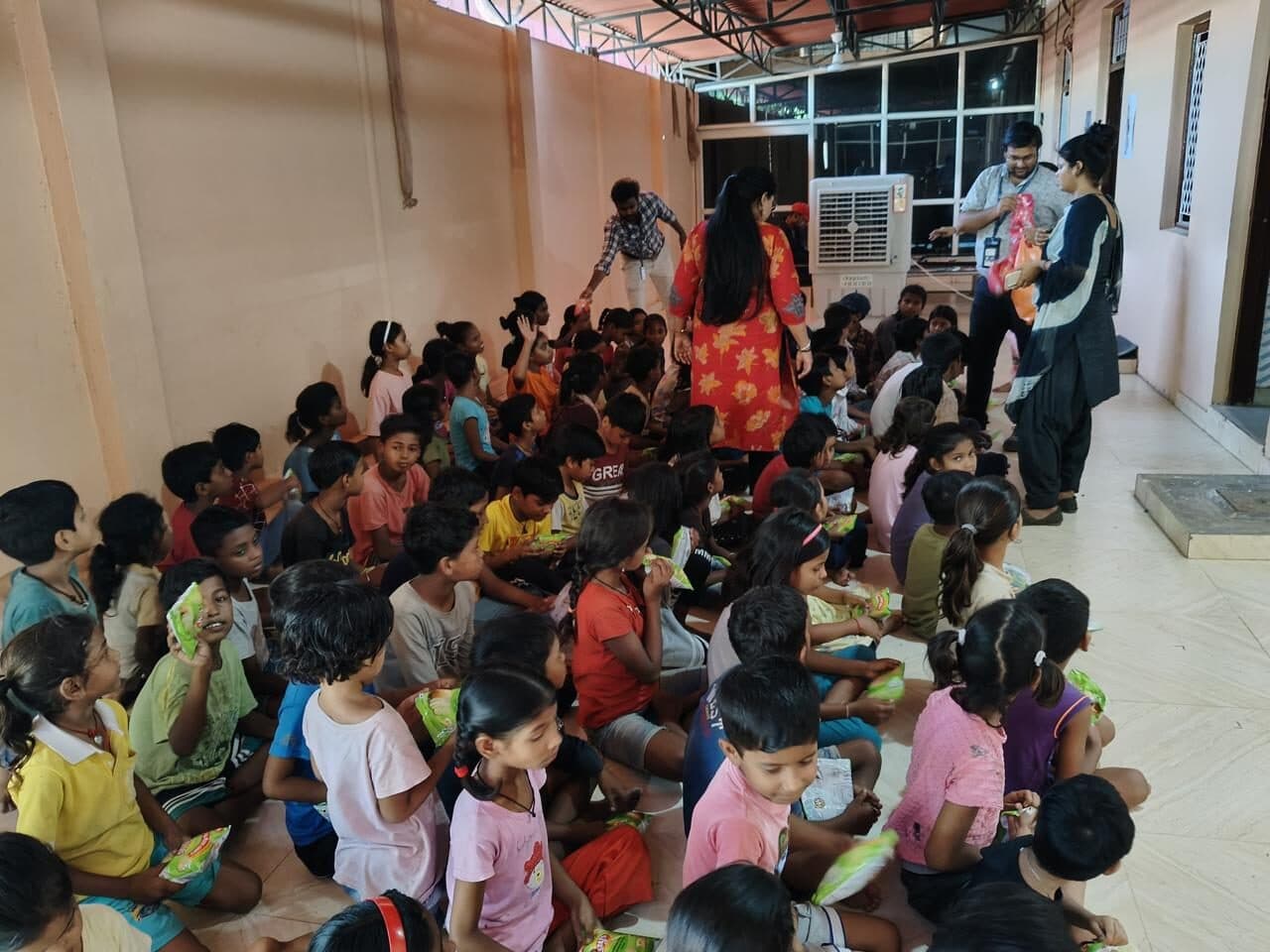 A packed community hall during a children's awareness session